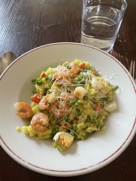 shrimp risotto with egg and a glass of water