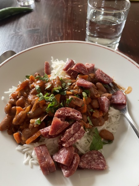 rice, beans, veggies and pieces of sausage